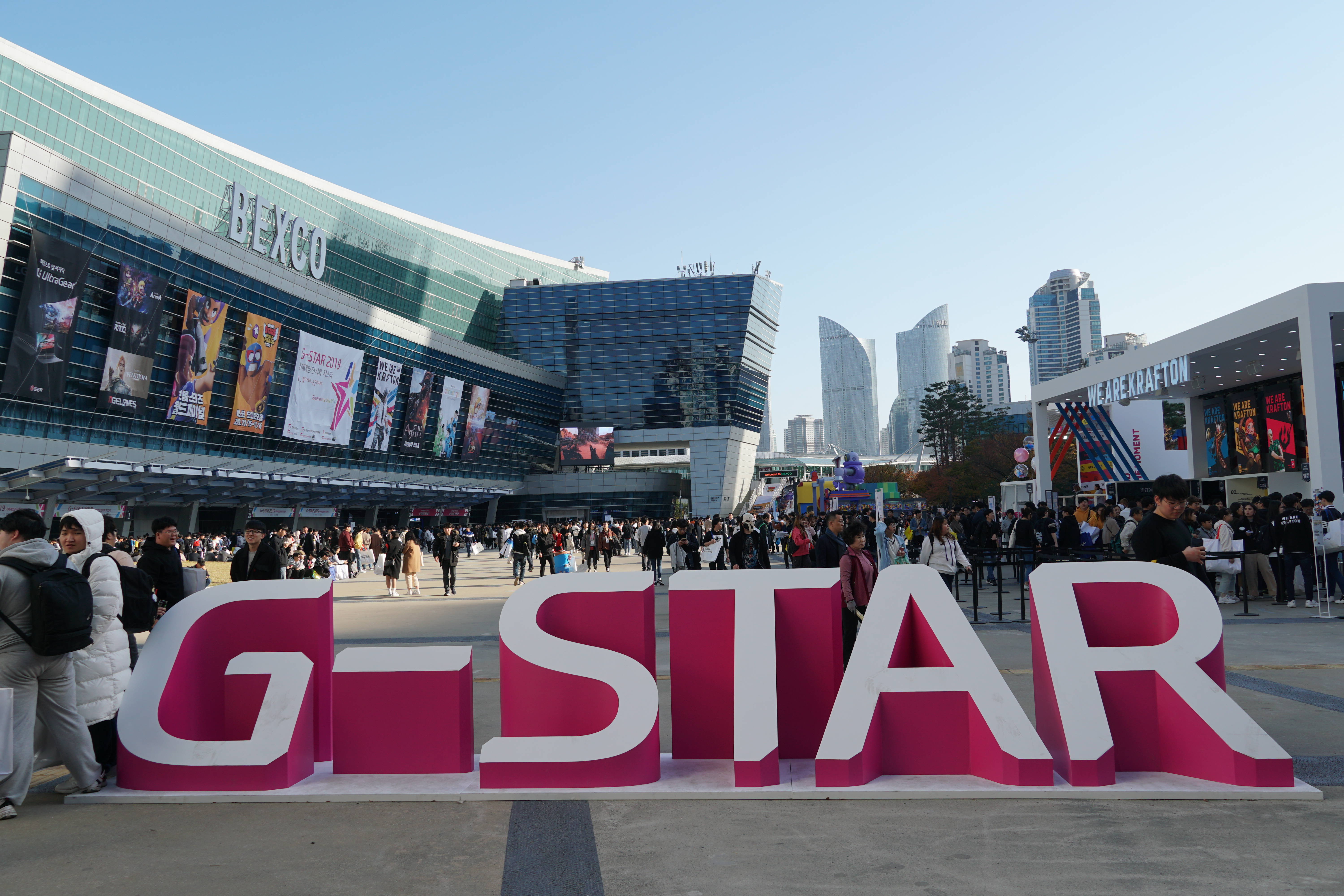 A pink and white sign for the G-STAR global gaming expo.